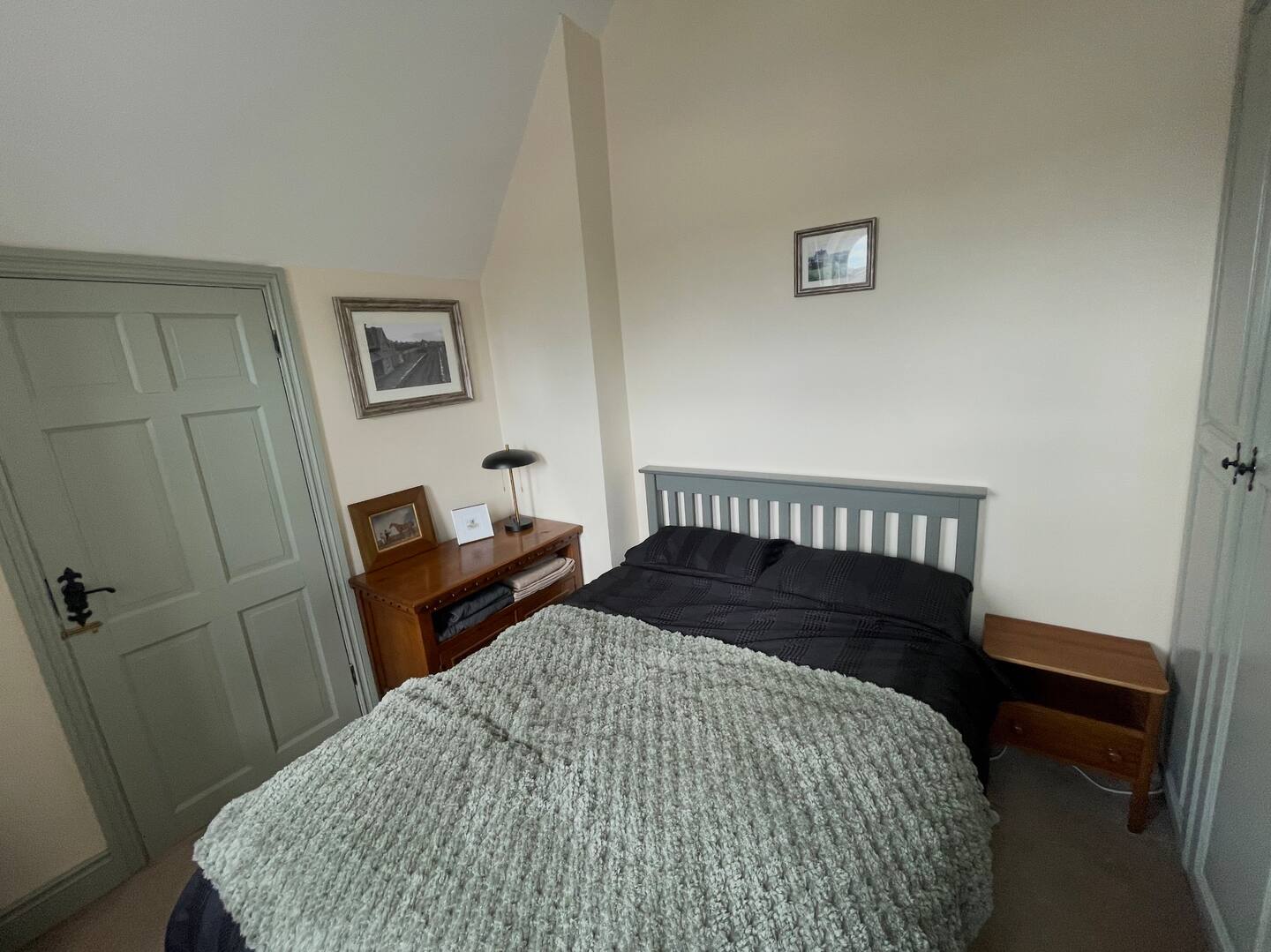 Lamp, art and plenty bedside storage
